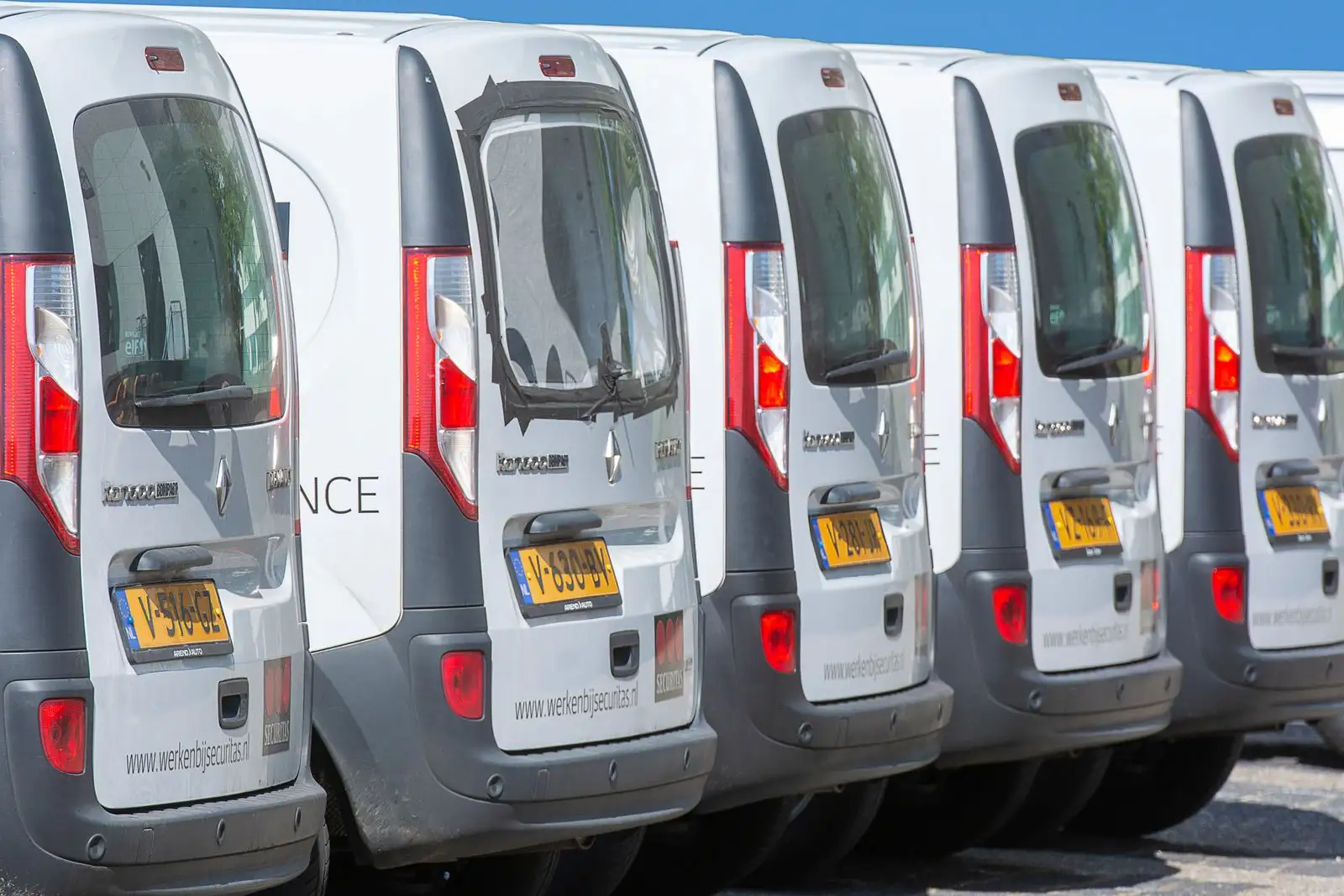 Row of white fleet cargo vans