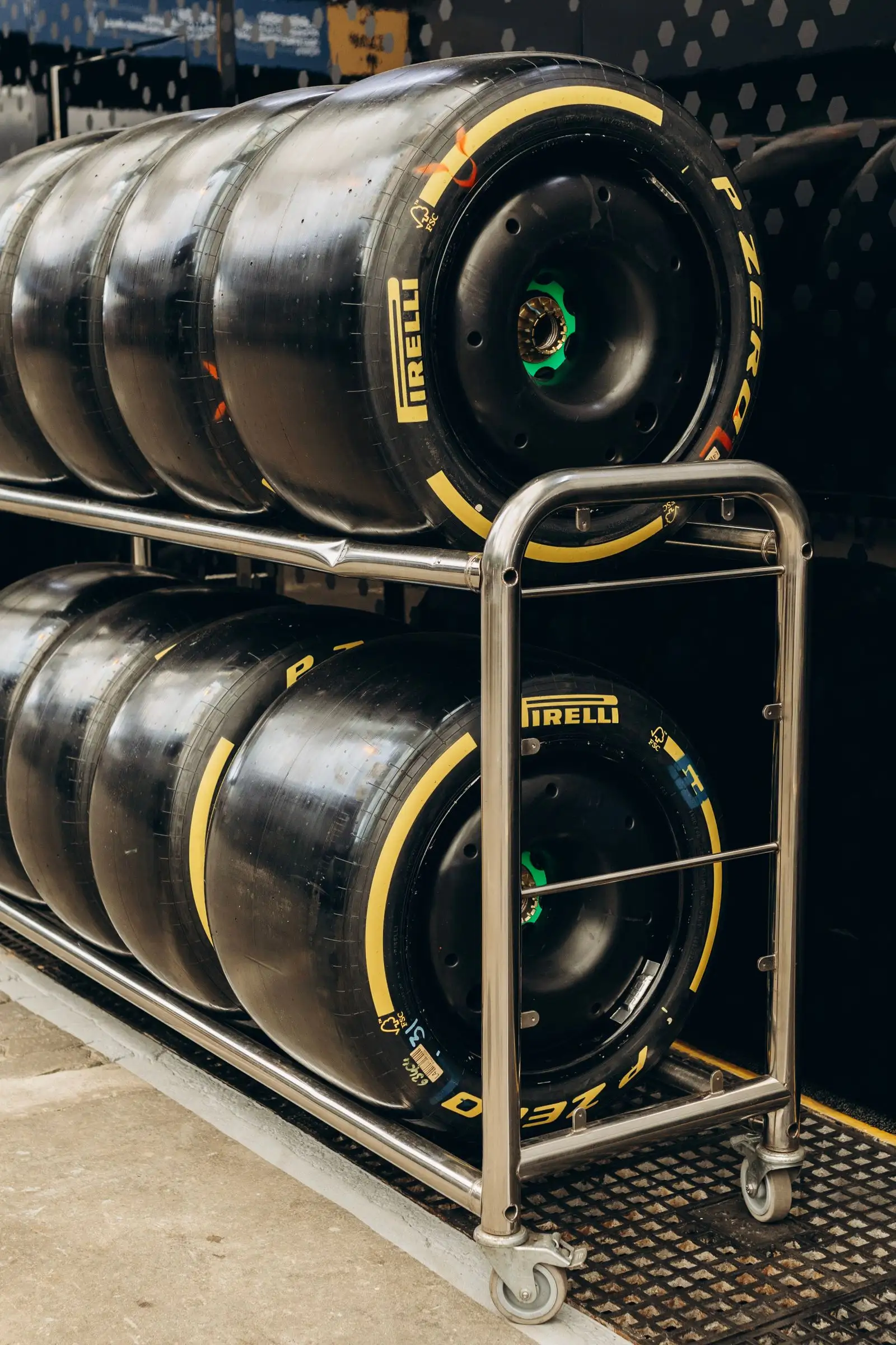 Racing tires stacked on a rack