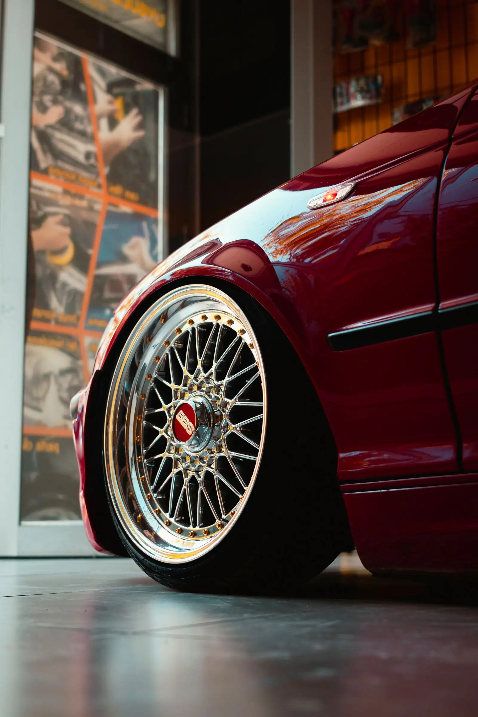 Gold mesh wheel on a red sports car