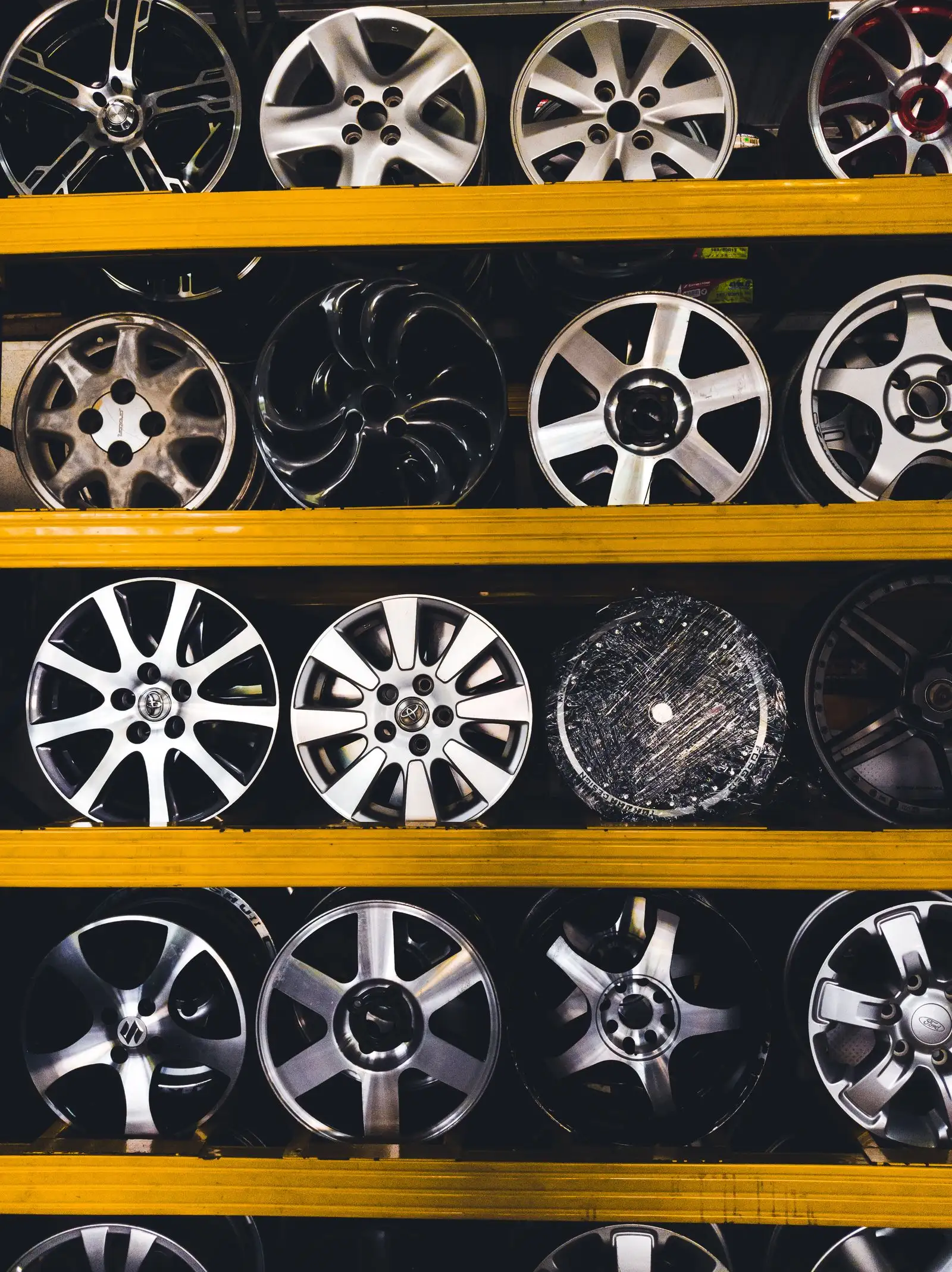 Wall of alloy wheels in a shop